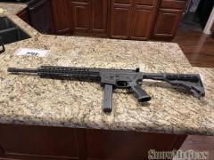 CMMG 9MM with 10-32 round magazines